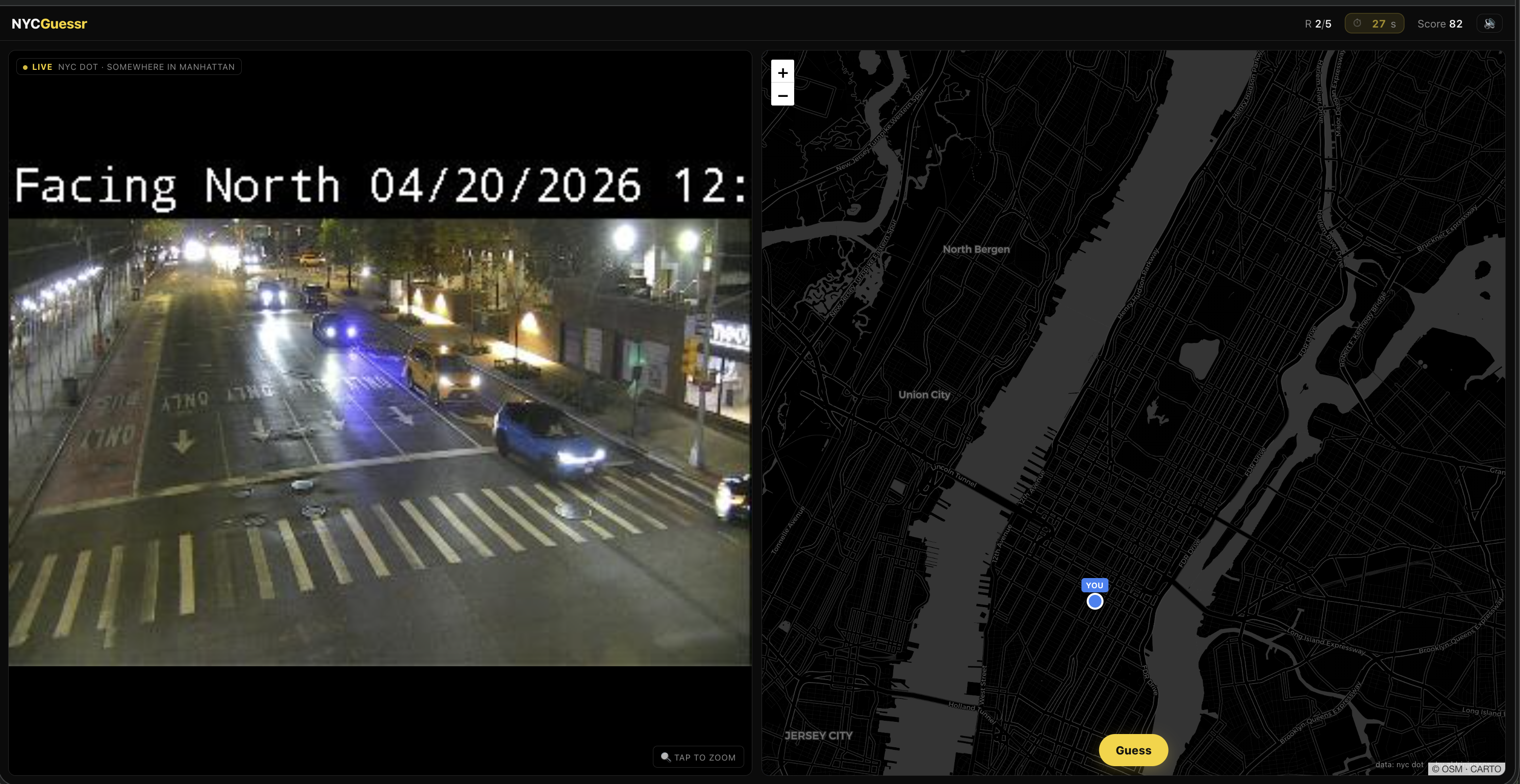 NYCGuessr mid-round — live traffic camera feed on the left shows a night-time Manhattan street with headlights and a 'Facing North' overlay; the right half is a dark map with a blue guess-pin dropped in Manhattan